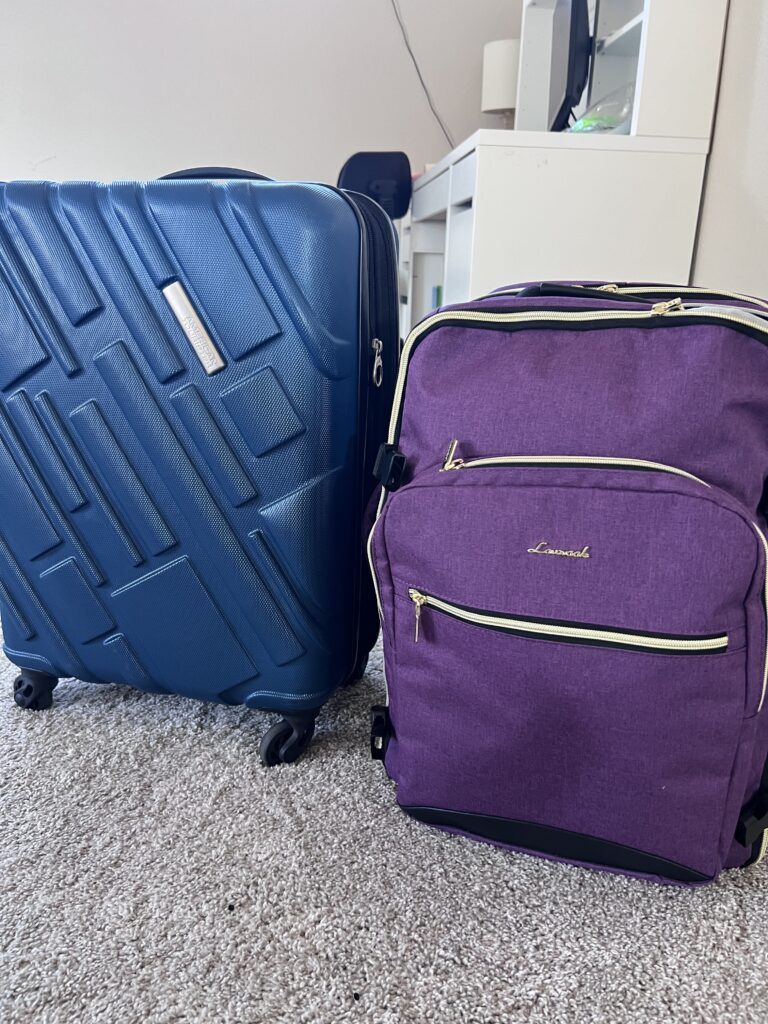 Navy carry-on suitcase, and purple travel back pack for Disney Cruise.