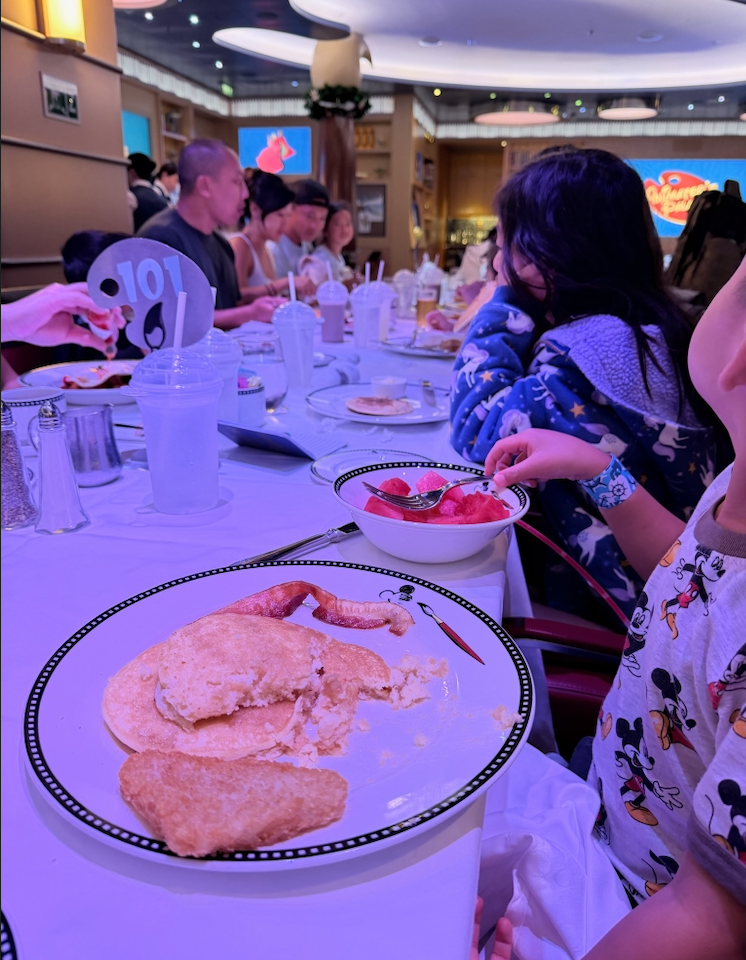 Family eating a meal on disney cruise ship. 